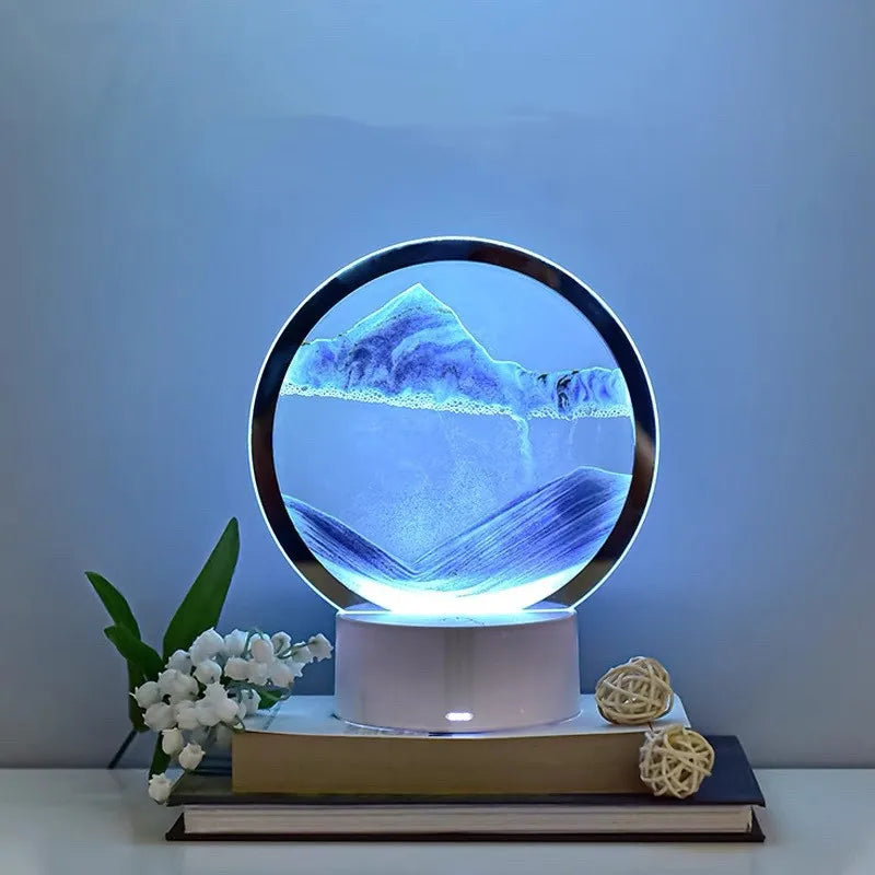 Decorative lamp with mountain and water design on a white surface