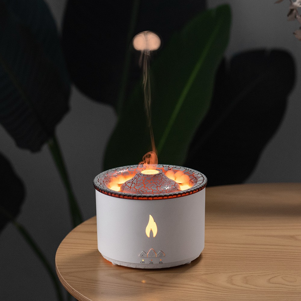 “LED volcano diffuser humidifier creating flame effect with mist in dark room”