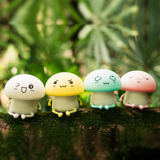 Four colorful mushroom-shaped figurines with expressions on a mossy surface.